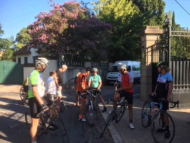 Cyclists gathering at the gates of La Villa de Mazamet before a morning ride